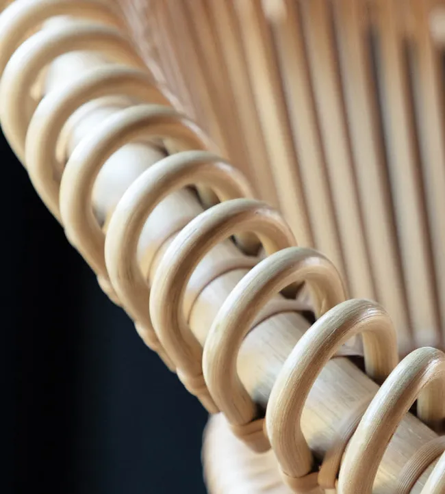 Close-up of Cruz Cocoon by Vincent Sheppard, highlighting the looped and vertical rattan frame construction.