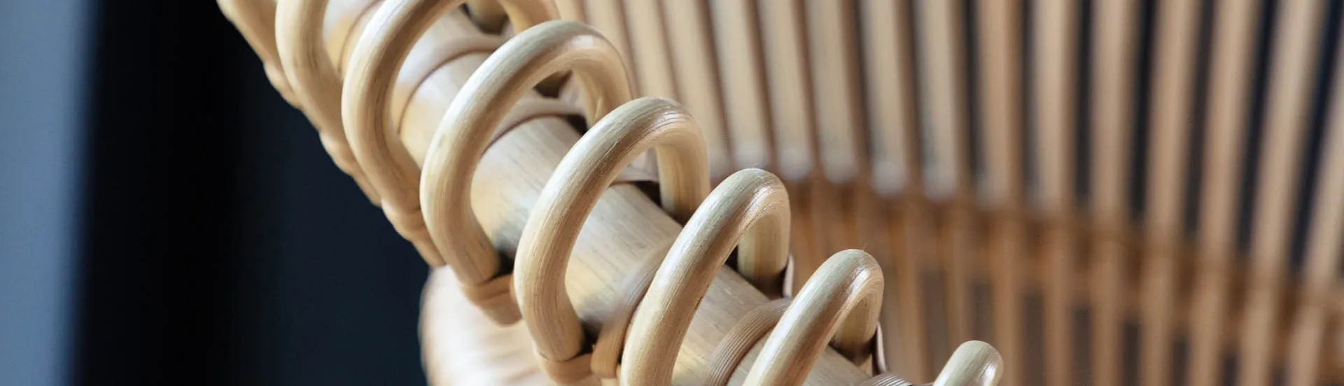 Close-up of Cruz Cocoon by Vincent Sheppard, highlighting the looped and vertical rattan frame construction.