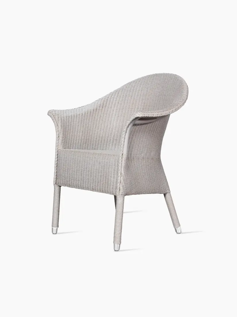 Angle view of the Victor Dining Armchair in pure white woven loom.