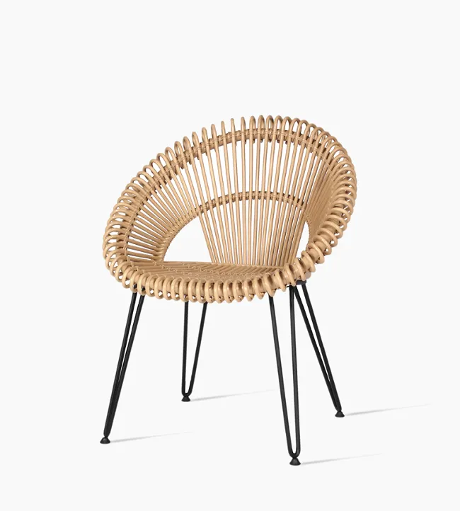 Front view of the Curly dining chair in natural rattan with an open woven circular seat and powder coated steel frame.